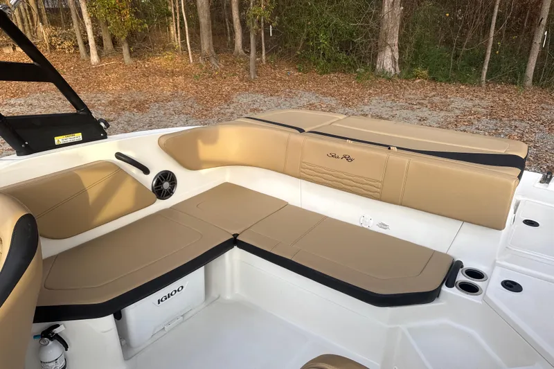 Slide: The Image of 2023 Sea Ray SPX 210 boat interior with tan seating and speaker. - 27