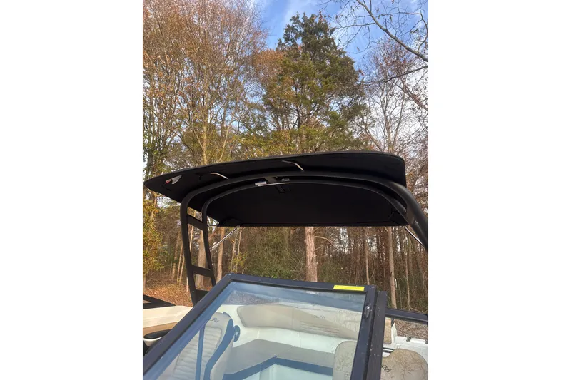 Slide: The Image of 2023 Sea Ray SPX 210 boat interior with beige seating and sleek design. - 29