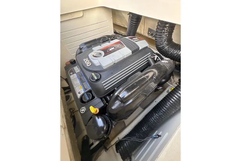 Slide: The Image of 2023 Sea Ray SPX 210 engine compartment showcasing powerful 200 HP engine. - 31