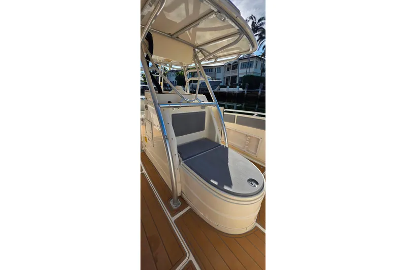 Slide: The Image of Open storage compartment on 2004 World Cat 330 TE boat, showing interior contents. - 17