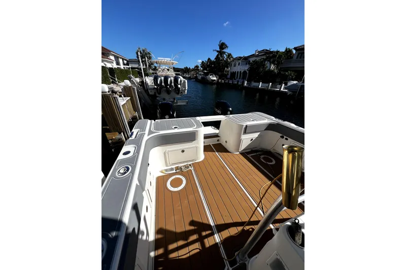 Slide: The Image of 2004 World Cat 330 TE boat docked in sunny marina setting. - 2