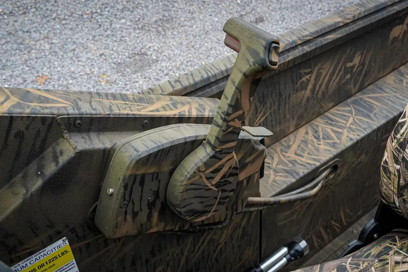 Slide: The Image of Camouflage interior of 2026 G3 Sportsman 2100 boat with control lever. - 15