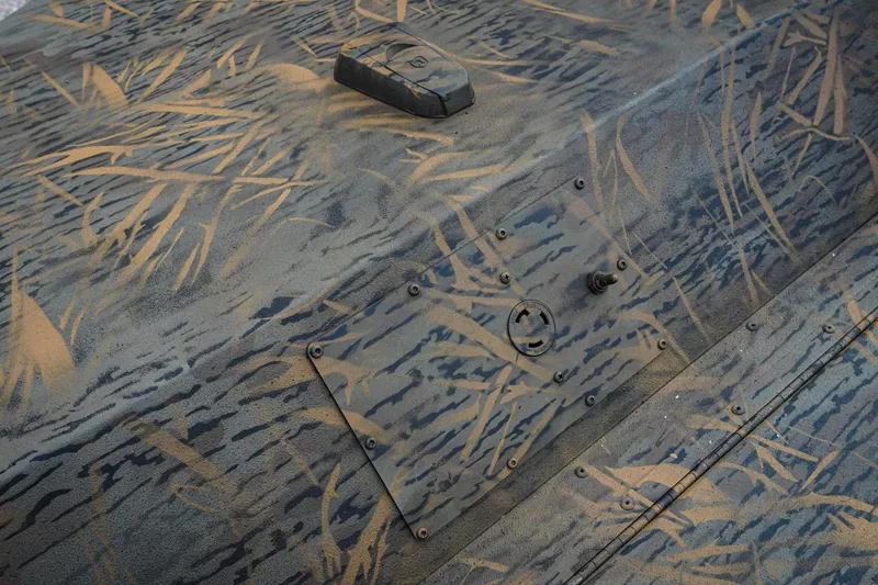 Slide: The Image of Camouflage pattern on 2026 G3 Sportsman 2100 boat surface, featuring naturalistic design. - 19