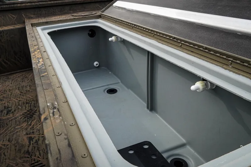 Slide: The Image of Open storage compartment in 2026 G3 Sportsman 2100 boat, showcasing interior design. - 23