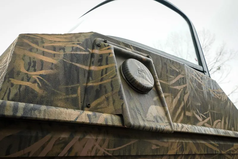 Slide: The Image of 2026 G3 Sportsman 2100 boat with camouflage design, close-up view. - 30