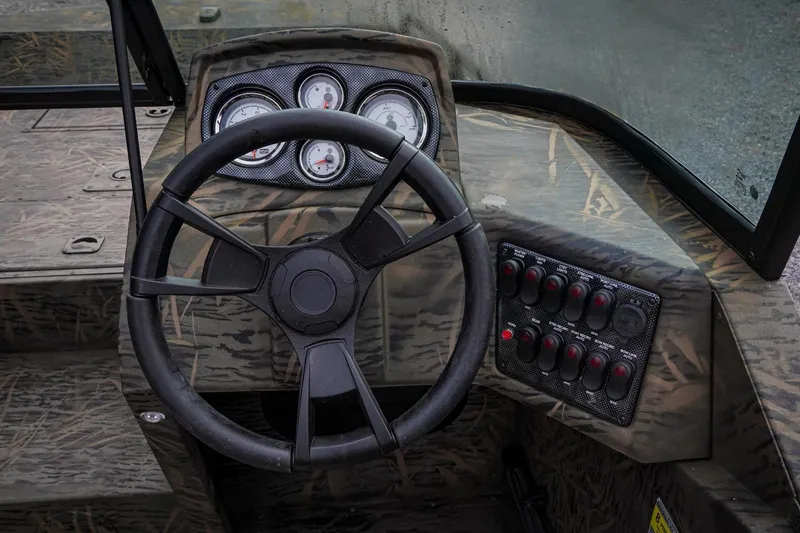 Slide: The Image of Steering console of 2026 G3 Sportsman 2100 boat with gauges and control panel. - 9
