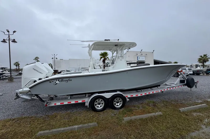 Slide: The Image of 2007 Yellowfin 31 Center Console boat on trailer, parked outdoors on a cloudy day. - 10