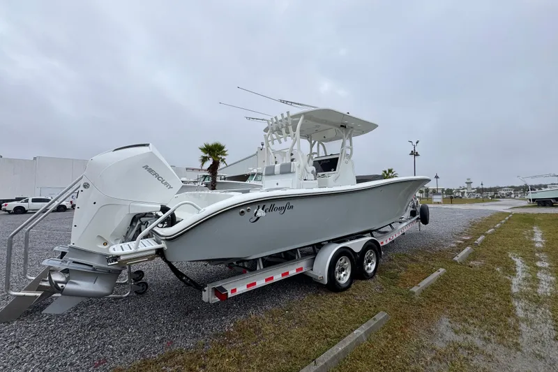 Slide: The Image of 2007 Yellowfin 31 Center Console boat on trailer, overcast day, parked outdoors. - 11