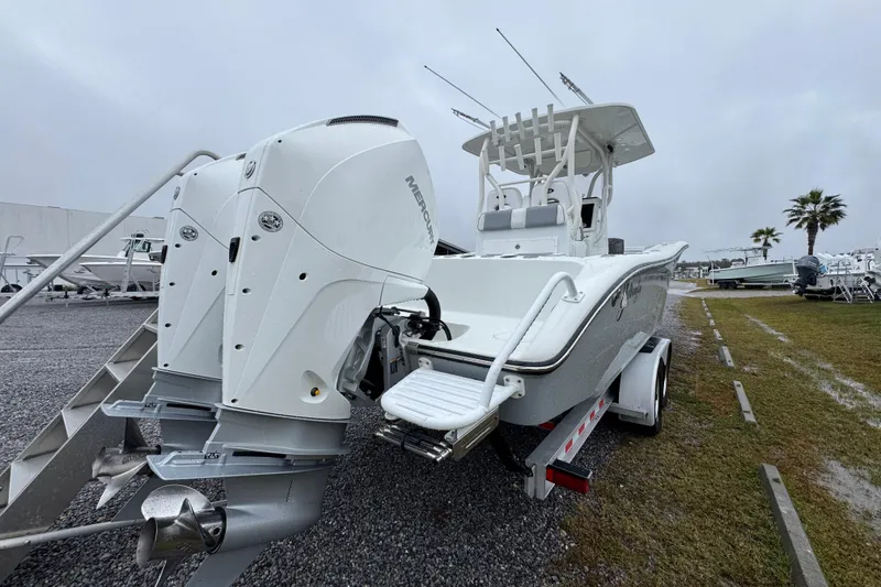 Slide: The Image of 2007 Yellowfin 31 Center Console boat with dual Mercury engines on a trailer. - 12