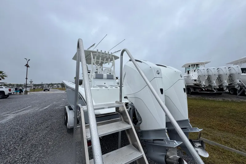 Slide: The Image of 2007 Yellowfin 31 Center Console boat with dual outboard engines on a trailer. - 14