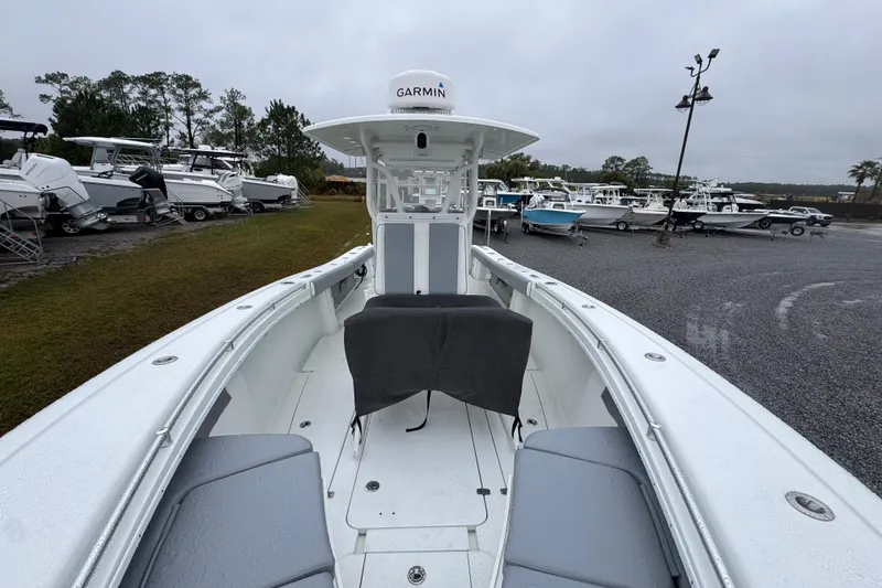Slide: The Image of 2007 Yellowfin 31 Center Console boat in a marina, overcast day. - 18