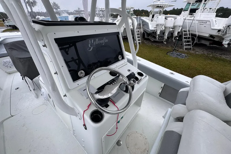 Slide: The Image of 2007 Yellowfin 31 Center Console boat interior with steering wheel and control panel. - 24