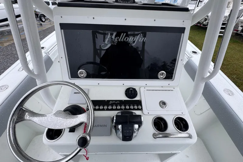 Slide: The Image of 2007 Yellowfin 31 Center Console boat dashboard with steering wheel and controls. - 25