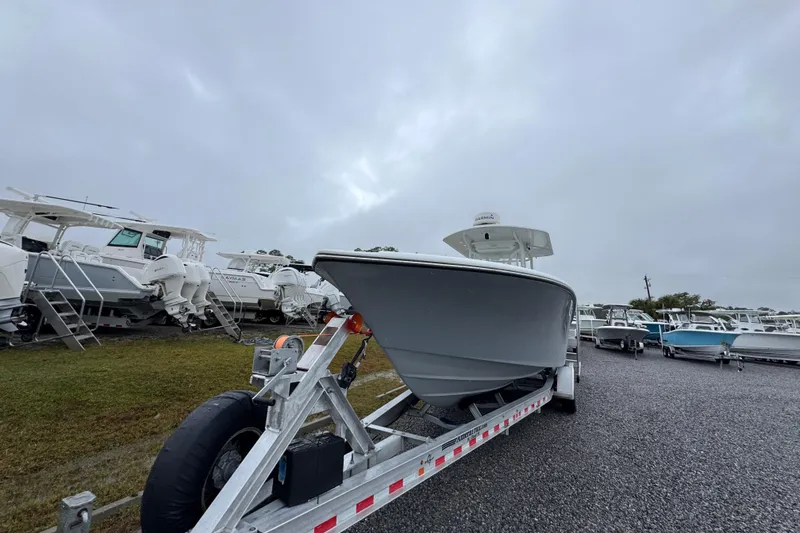 Slide: The Image of 2007 Yellowfin 31 Center Console boat on trailer in a marina. - 5