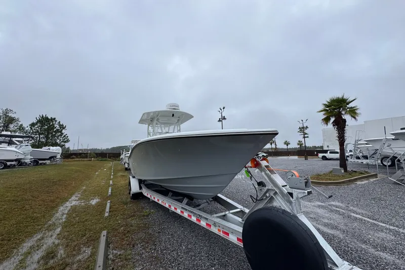 Slide: The Image of 2007 Yellowfin 31 Center Console boat on trailer in outdoor lot. - 7