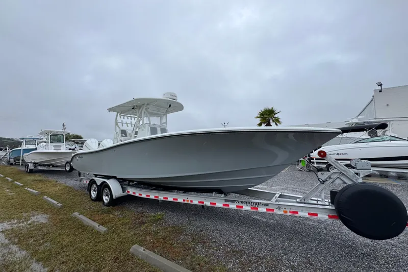 Slide: The Image of 2007 Yellowfin 31 Center Console boat on trailer, parked outdoors. - 8