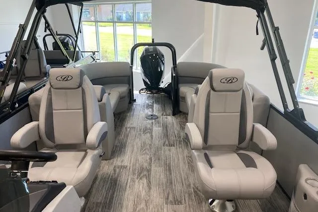 Slide: The Image of 2026 Bentley Pontoons Legacy 243 Navigator interior with luxurious seating and modern design. - 11
