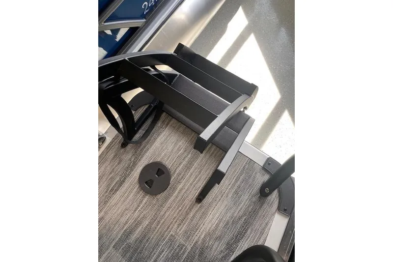 Slide: The Image of 2026 Bentley Pontoons Legacy 243 Navigator deck with ladder and textured flooring. - 17