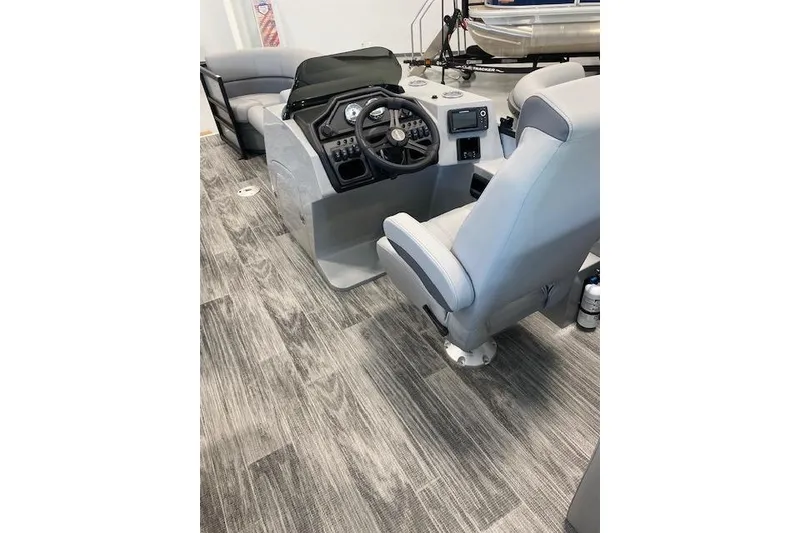 Slide: The Image of 2026 Bentley Pontoons Legacy 243 Navigator interior with modern helm and seating. - 20