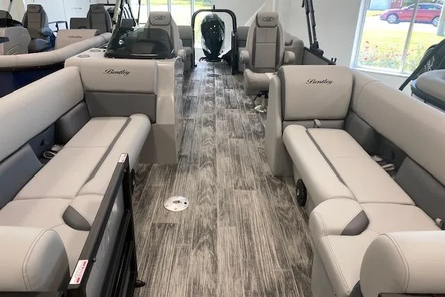 Slide: The Image of 2026 Bentley Pontoons Legacy 243 Navigator interior with luxurious seating and modern design. - 21