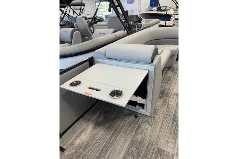 Slide: The Image of 2026 Bentley Pontoons Legacy 243 Navigator with fold-out table and cup holders. - 4