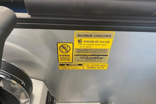Slide: The Image of Bentley Pontoons Legacy 243 Navigator 2026 capacity label, 16 persons or 2540 lbs limit. - 7