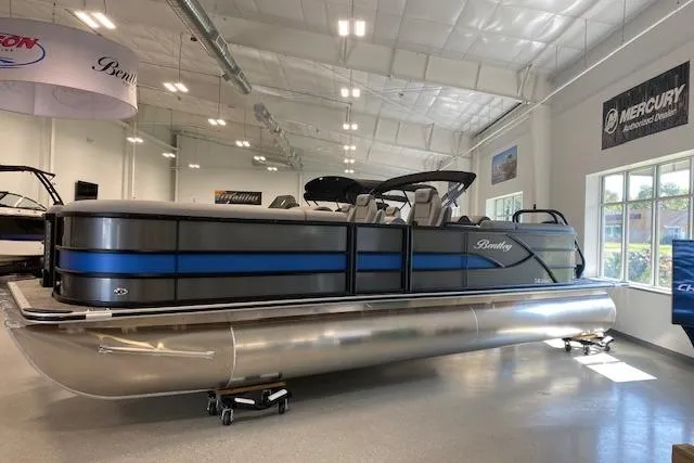 The Image of 2026 Bentley Pontoons Legacy 243 Navigator displayed in a showroom, featuring sleek design and modern amenities. - 0