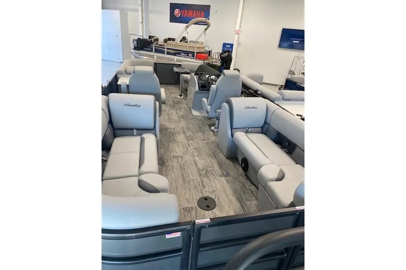 Slide: The Image of 2026 Bentley Pontoons Legacy 243 Navigator interior with gray seating and modern design. - 11