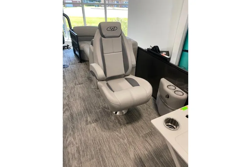 Slide: The Image of 2026 Bentley Pontoons Legacy 243 Navigator interior with luxurious seating and modern design. - 9