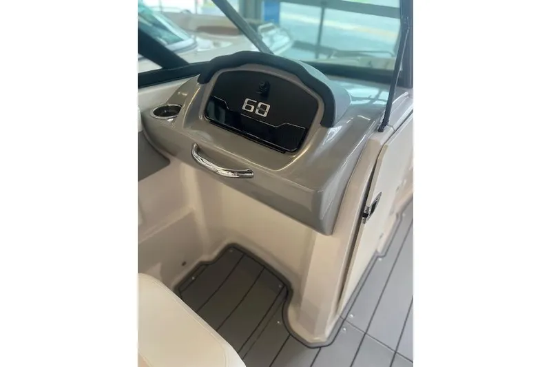 Slide: The Image of 2025 Chaparral 23 Surf boat dashboard with digital display and sleek design. - 10