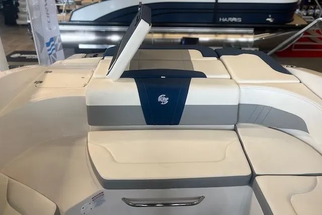 Slide: The Image of 2025 Chaparral 23 Surf boat interior with cushioned seating and storage compartments. - 15