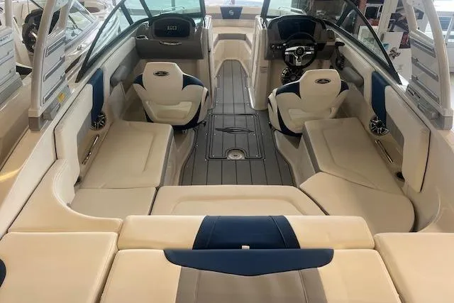 Slide: The Image of 2025 Chaparral 23 Surf boat interior with luxurious seating and modern dashboard. - 23