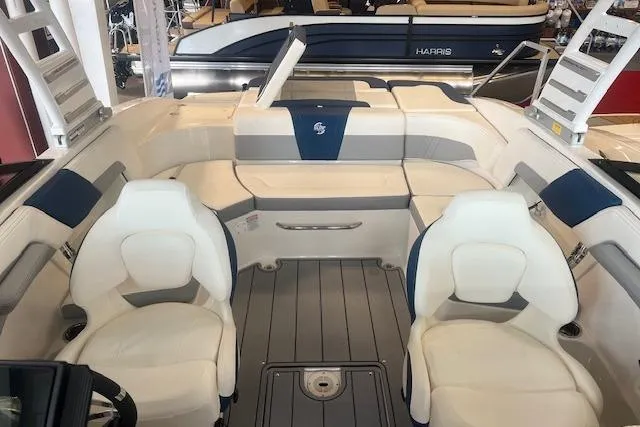 Slide: The Image of 2025 Chaparral 23 Surf boat interior with white seating and modern design. - 5