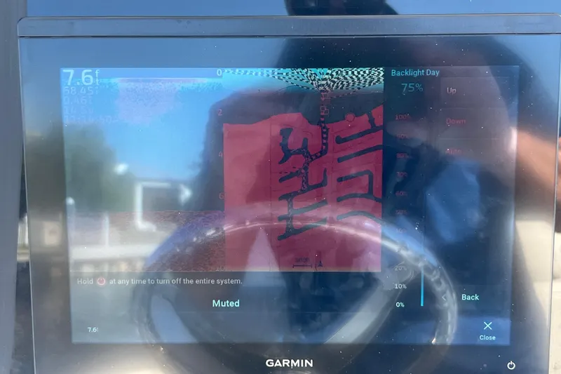 Slide: The Image of Garmin marine display on a 2004 Sea Hunt Ultra 234 boat, showing depth and settings. - 11