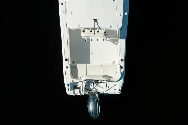 Slide: The Image of Aerial view of 2004 Sea Hunt Ultra 234 boat on dark water. - 5