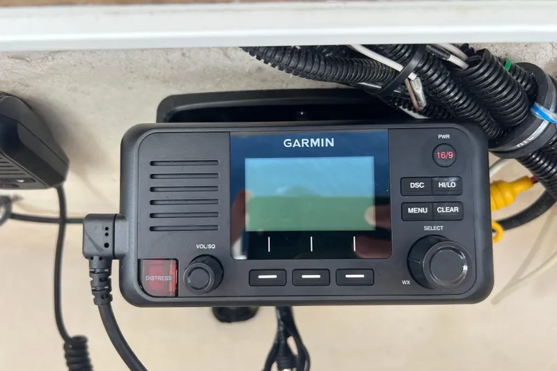 Slide: The Image of Garmin marine radio on 2004 Sea Hunt Ultra 234 boat dashboard. - 9