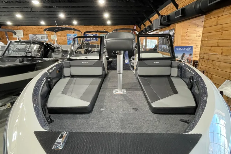 Slide: The Image of 2026 Lund 202 Pro-V GL boat interior with seating and modern design. - 10