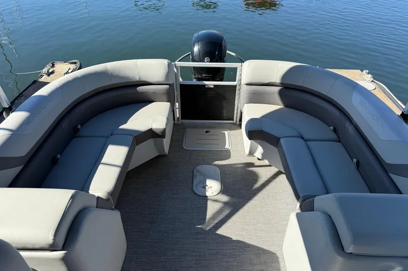 Slide: The Image of 2023 Bennington 22SX Stern Radius pontoon boat interior with plush seating. - 7