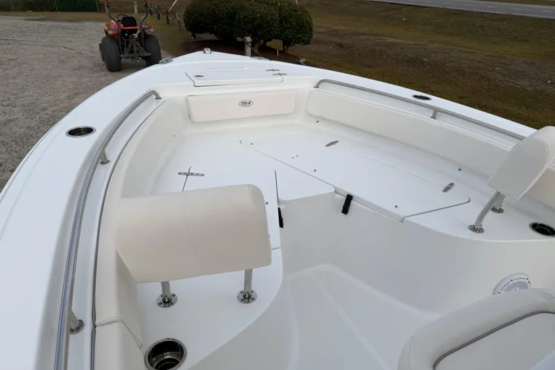 Slide: The Image of 2024 Sea Hunt Ultra 229 boat interior with seating and storage compartments. - 10