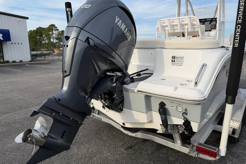Slide: The Image of 2024 Sea Hunt Ultra 229 boat with Yamaha outboard motor at service center. - 22