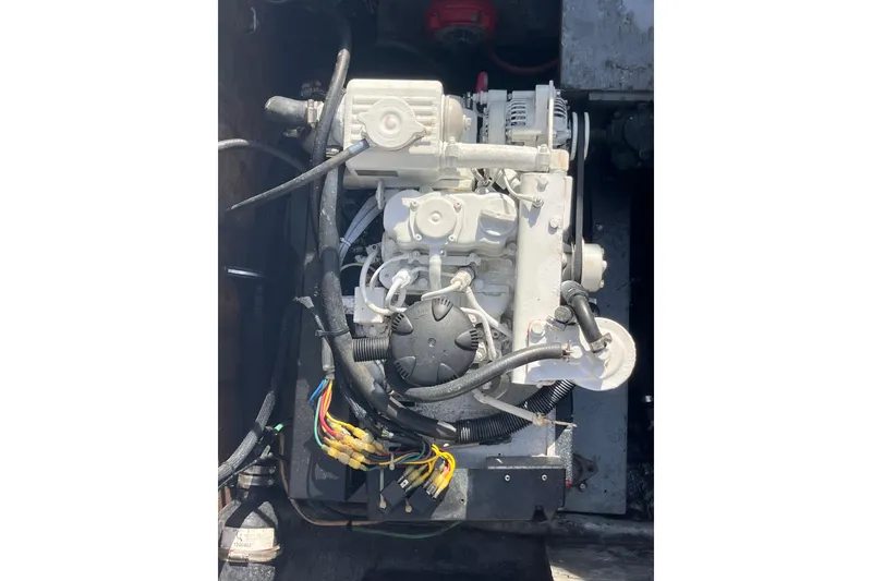 Slide: The Image of Engine of a 1981 Bertram 35 Sportfish boat with visible wiring and components. - 17