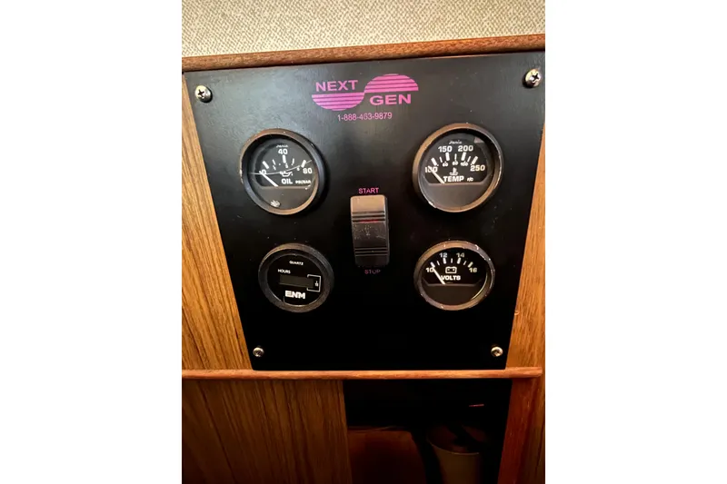 Slide: The Image of Control panel of a 1981 Bertram 35 Sportfish boat with gauges and switches. - 31