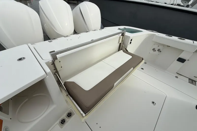 Slide: The Image of 2020 Edgewater 370CC boat with foldable seating and triple outboard engines. - 12