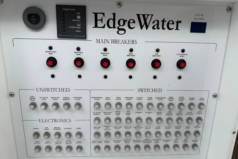 Slide: The Image of Electrical panel of 2020 Edgewater 370CC boat with main breakers and switches. - 8