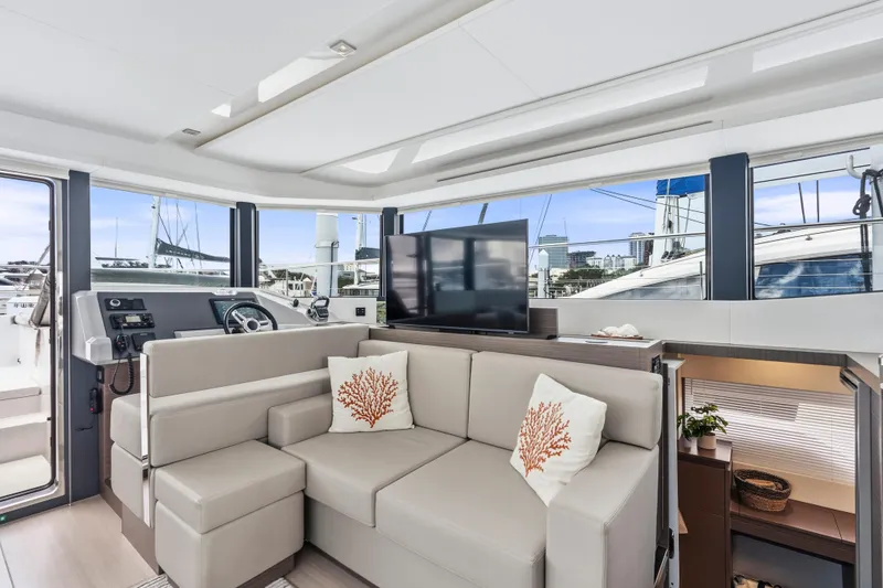 Slide: The Image of Helm of 2025 Leopard 53 Powercat with modern navigation controls and ocean view. - 10