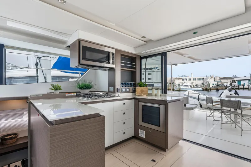 Slide: The Image of Luxurious interior of 2025 Leopard 53 Powercat yacht with modern seating and decor. - 13