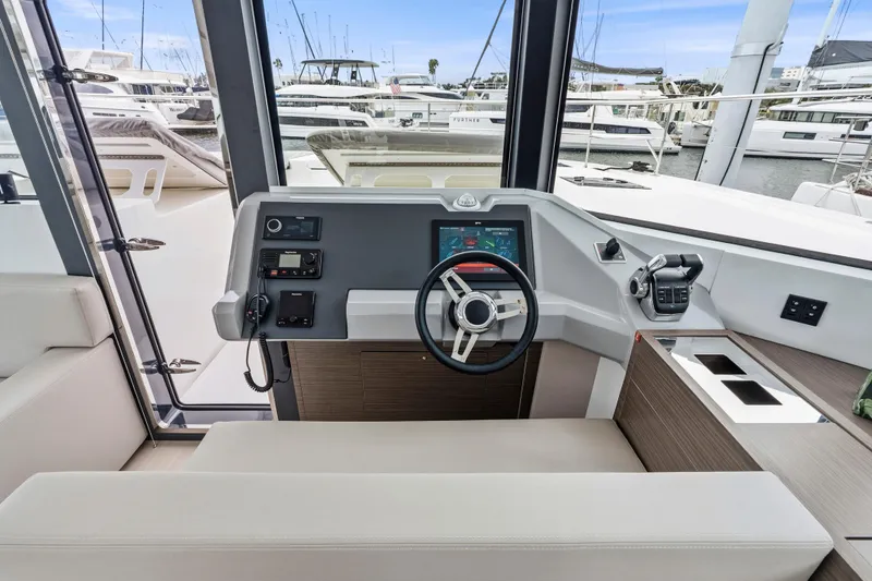 Slide: The Image of 2025 Leopard 53 Powercat yacht on water, rear view with tender boat. - 2