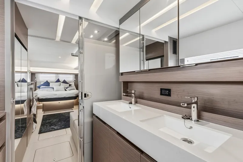 Slide: The Image of Luxurious bedroom interior of 2025 Leopard 53 Powercat yacht with modern design and large TV. - 22