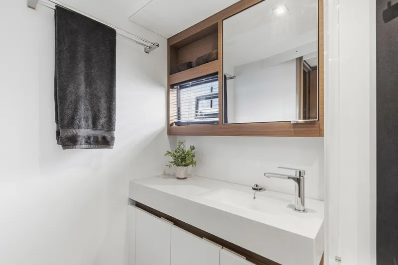 Slide: The Image of Luxurious bedroom interior of 2025 Leopard 53 Powercat yacht with modern design and cozy bedding. - 29