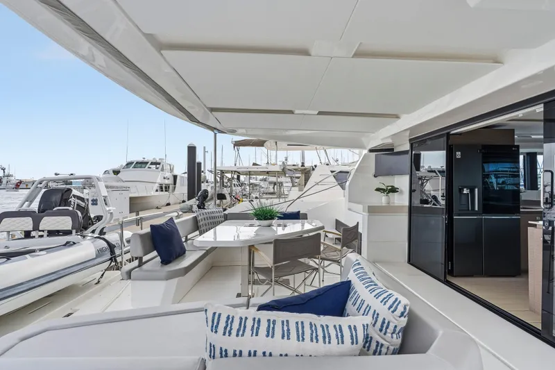 Slide: The Image of Luxurious 2025 Leopard 53 Powercat yacht deck with seating and ocean view. - 36